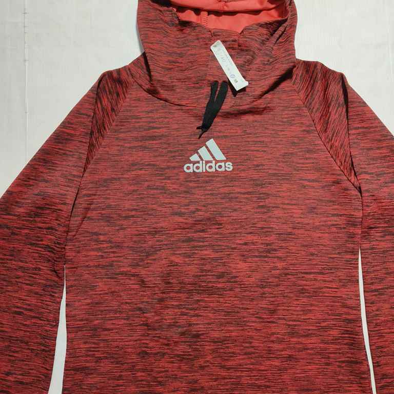 Elevate your casual wardrobe with the Adidas Men's Red Heathered Pullover Hoodie. This stylish hoodie features a striking red heathered design, providing a modern and athletic look. The iconic Adidas logo is prominently displayed on the chest, showcasing your brand loyalty. Made from high-quality materials, this hoodie offers both comfort and durability, making it perfect for workouts, outdoor activities, or everyday wear. The adjustable drawstring hood ensures a snug fit, while the long sleeves provide extra warmth. Stay comfortable and fashionable with this versatile Adidas hoodie.